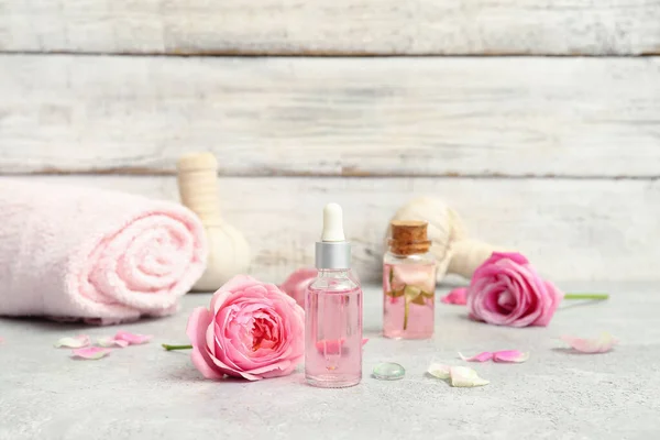 Bottles Cosmetic Oil Rose Extract Flowers White Table — Stock Photo, Image