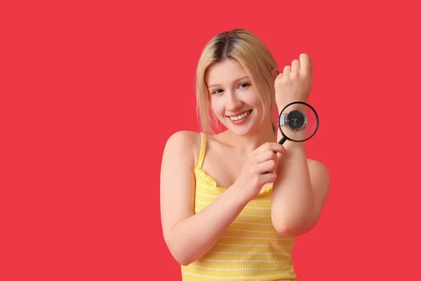 Young Woman Magnifier Wristwatch Red Background — Stock Photo, Image