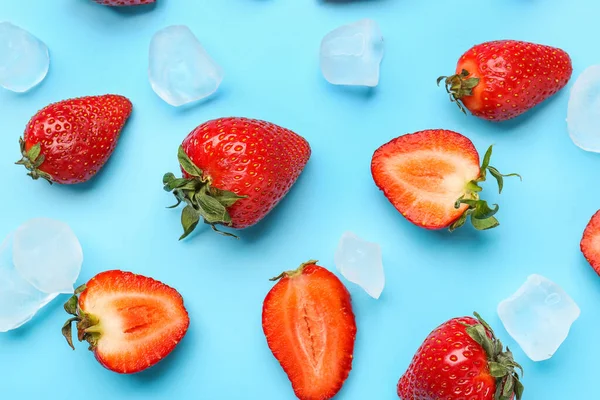 stock image Fresh strawberries with ice cubes on blue background