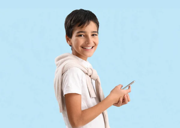 Little Boy Using Mobile Phone Blue Background — 스톡 사진