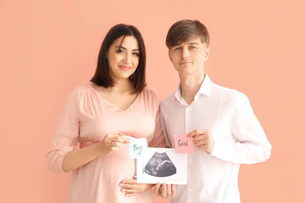 Young Pregnant Couple Holding Sonogram Image Papers Sex Baby Pink — Stock Photo, Image