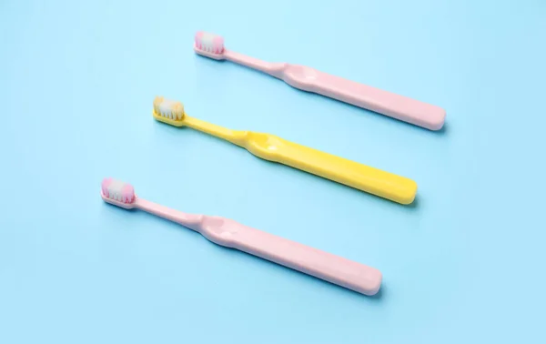 Plastic Toothbrushes Blue Background — Stock Photo, Image