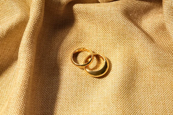 Beautiful Rings Beige Fabric Background — Stock Photo, Image