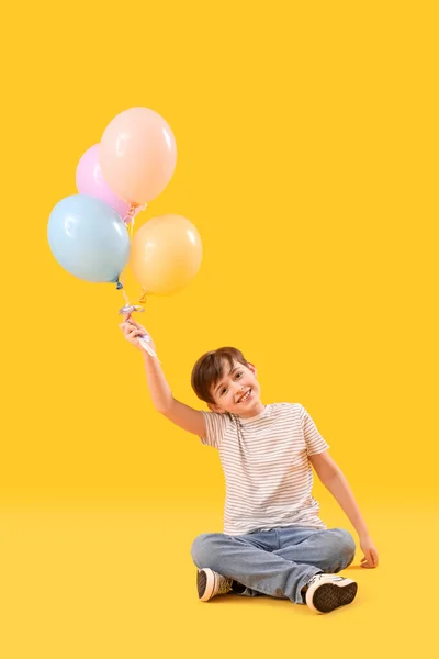 Little Boy Balloons Sitting Yellow Background Children Day Celebration — Stock Photo, Image