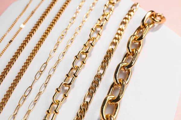 Decorative Stand Golden Bracelets Necklaces Color Background — Stock Photo, Image
