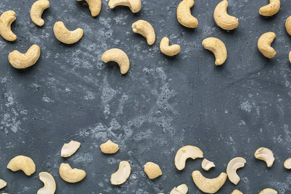 stock image Frame made of tasty cashew nuts on blue background