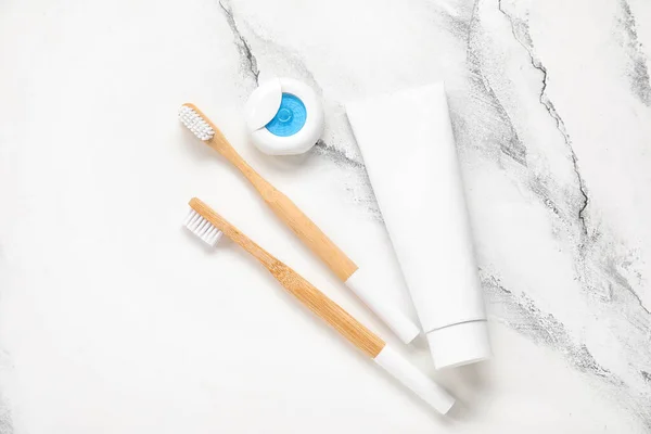 Dental Floss Paste Bamboo Toothbrush White Marble Background — Stock Photo, Image