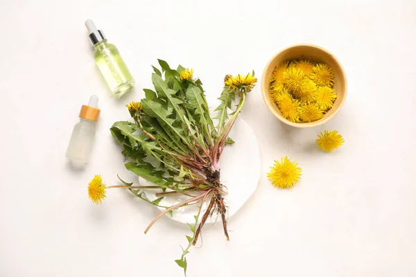 Bottles Cosmetic Oil Bowl Dandelion Flowers White Background — Stock Photo, Image