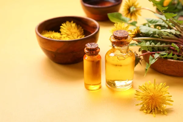 Bottles Cosmetic Oil Bowls Dandelion Flowers Yellow Background — Stock Photo, Image