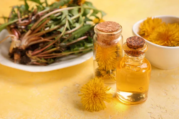 Bottles Cosmetic Oil Bowl Dandelion Flowers Yellow Background — Stock Photo, Image