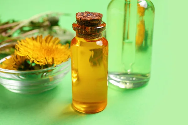 Bottles Cosmetic Oil Bowl Dandelion Flowers Green Background — Stock Photo, Image