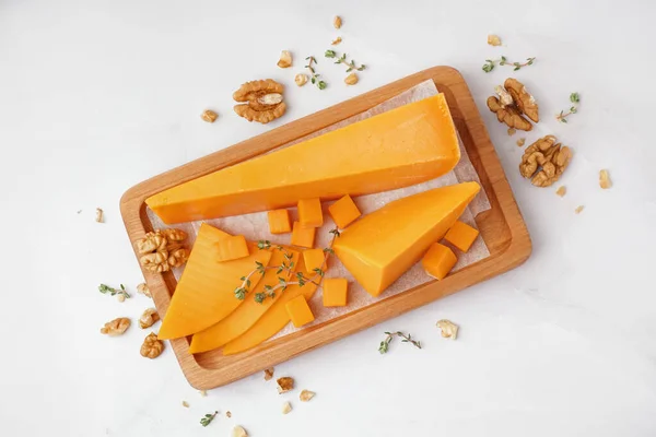 Wooden Board Tasty Cheddar Cheese Light Background — Stock Photo, Image