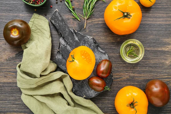 stock image Board with different fresh tomatoes on wooden background