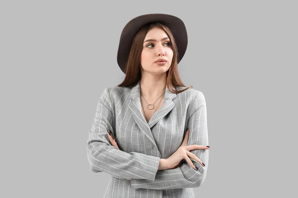 Stylish Young Woman Jacket Hat Grey Background — ストック写真