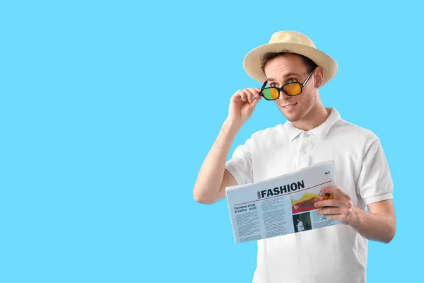 Young Man Reading Newspaper Blue Background — Stock Photo, Image