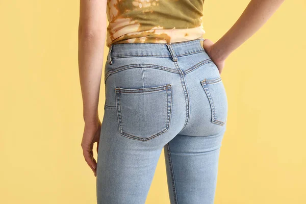 Young Woman Stylish Jeans Yellow Background Back View — Stock Photo, Image