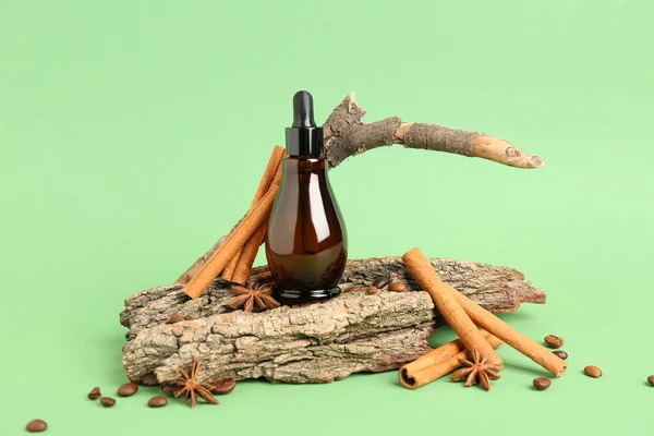 Composition Bottle Essential Oil Cinnamon Sticks Tree Bark Color Background — Stock Photo, Image