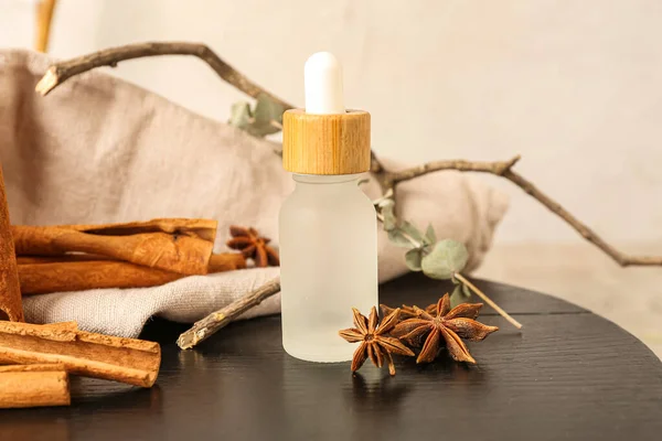 Bottle Essential Oil Cinnamon Sticks Anise Stars Tree Branch Wooden — Stock Photo, Image