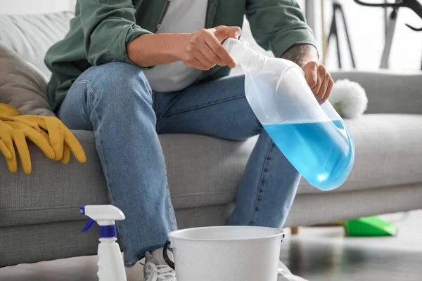 Young Man Bottle Detergent Home Closeup — Stock Photo, Image