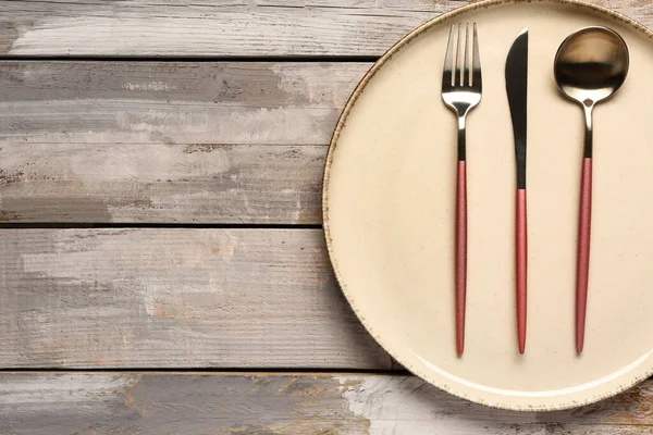 stock image Table setting with clean plate and cutlery on wooden table