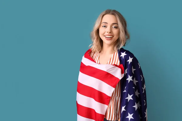 Stock image Young woman with USA flag on blue background