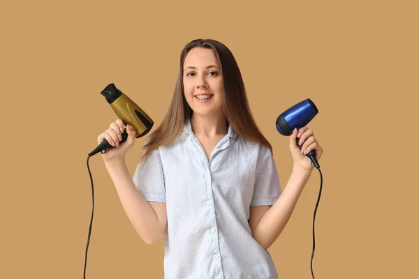 Beautiful Young Woman Hair Dryers Beige Background — Stock Photo, Image