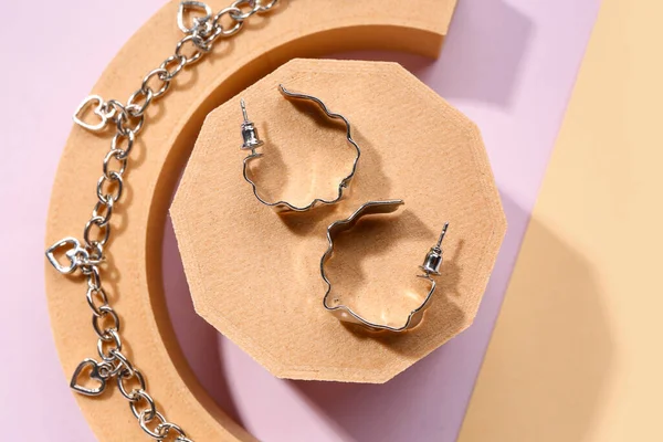 Decorative Podiums Silver Earrings Bracelet Color Background — Stock Photo, Image