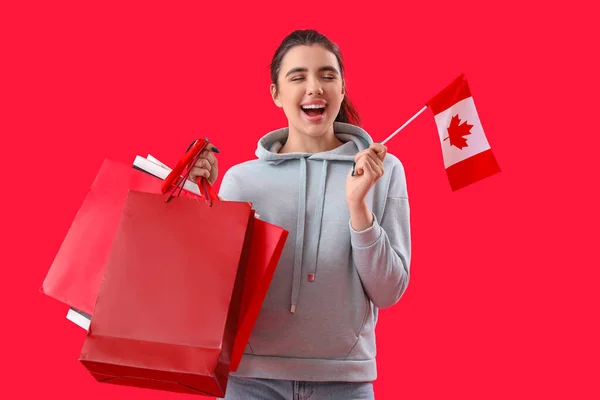 Young Woman Flag Canada Shopping Bags Red Background — Stock Photo, Image