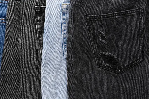 Różne Stylowe Dżinsy Jeansowe Jako Tło Zbliżenie — Zdjęcie stockowe