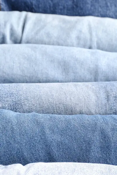 Different Folded Jeans Background Closeup — Stock Photo, Image