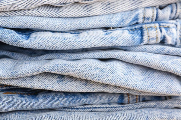 Stapel Verschiedener Stylischer Jeans Als Hintergrund Nahaufnahme — Stockfoto