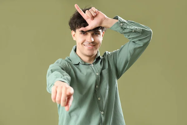 Young Man Showing Loser Gesture Pointing Viewer Green Background — Stock Photo, Image