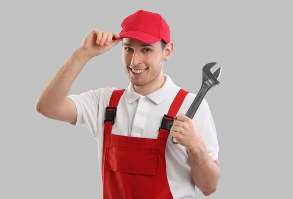 Male Plumber Wrench Grey Background — Stock Photo, Image