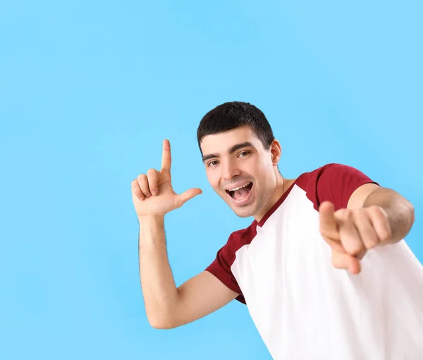 Young Man Showing Loser Gesture Blue Background — Stock Photo, Image