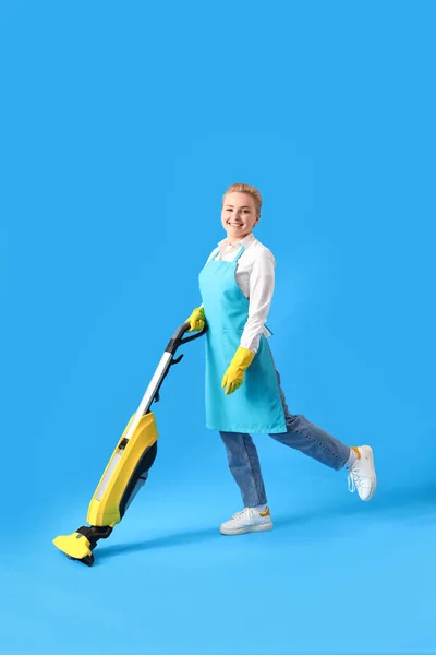 Young Woman Vacuum Cleaner Blue Background — Stock Photo, Image