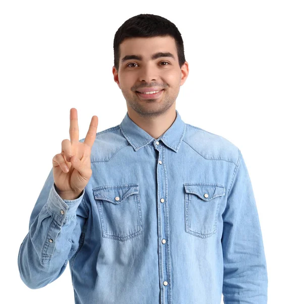 Молодой Человек Показывает Два Пальца Белом Фоне — стоковое фото