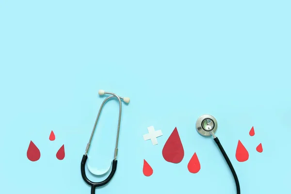 Stethoscope Paper Blood Drops Cross Blue Background World Donor Day — Stock Photo, Image