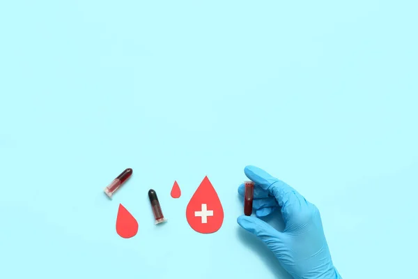 Female Doctor Test Tubes Paper Blood Drops Blue Background World — Stock Photo, Image