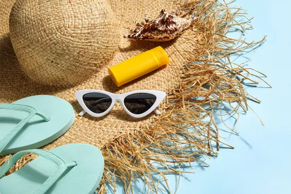 Summer Hat Sunglasses Seashell Sunscreen Cream Flip Flops Blue Background — Stock Photo, Image
