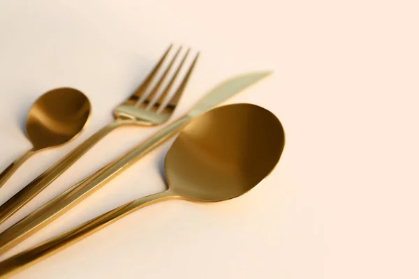 Golden Cutlery Beige Background — Stock Photo, Image