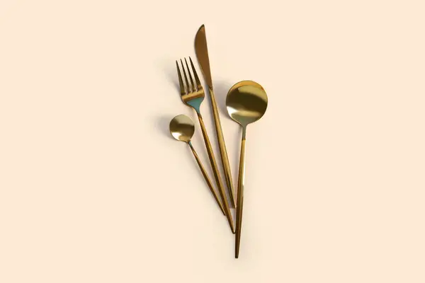 Golden Cutlery Beige Background — Stock Photo, Image