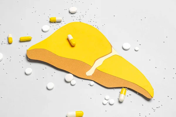 Yellow Paper Liver Pills Grey Background — Stock Photo, Image