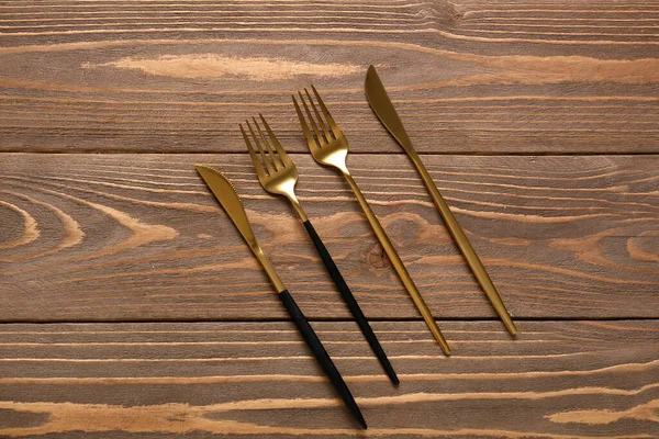 Golden Forks Knives Wooden Background — Stock Photo, Image