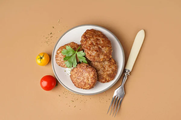 Cutlets Tomatoes Parsley Fork Beige Background — Stock Photo, Image