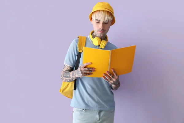 Tattooed Male Student Notebook Lilac Background — Stock Photo, Image