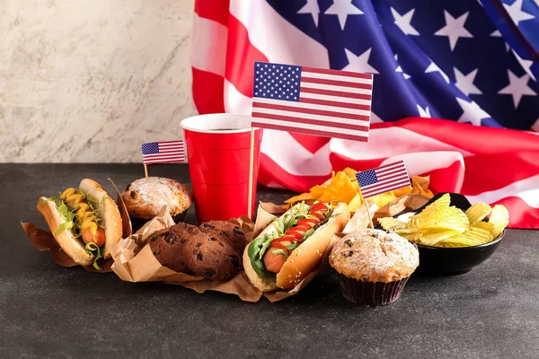 stock image Tasty dishes, drink and American flag on dark table. Memorial Day celebration