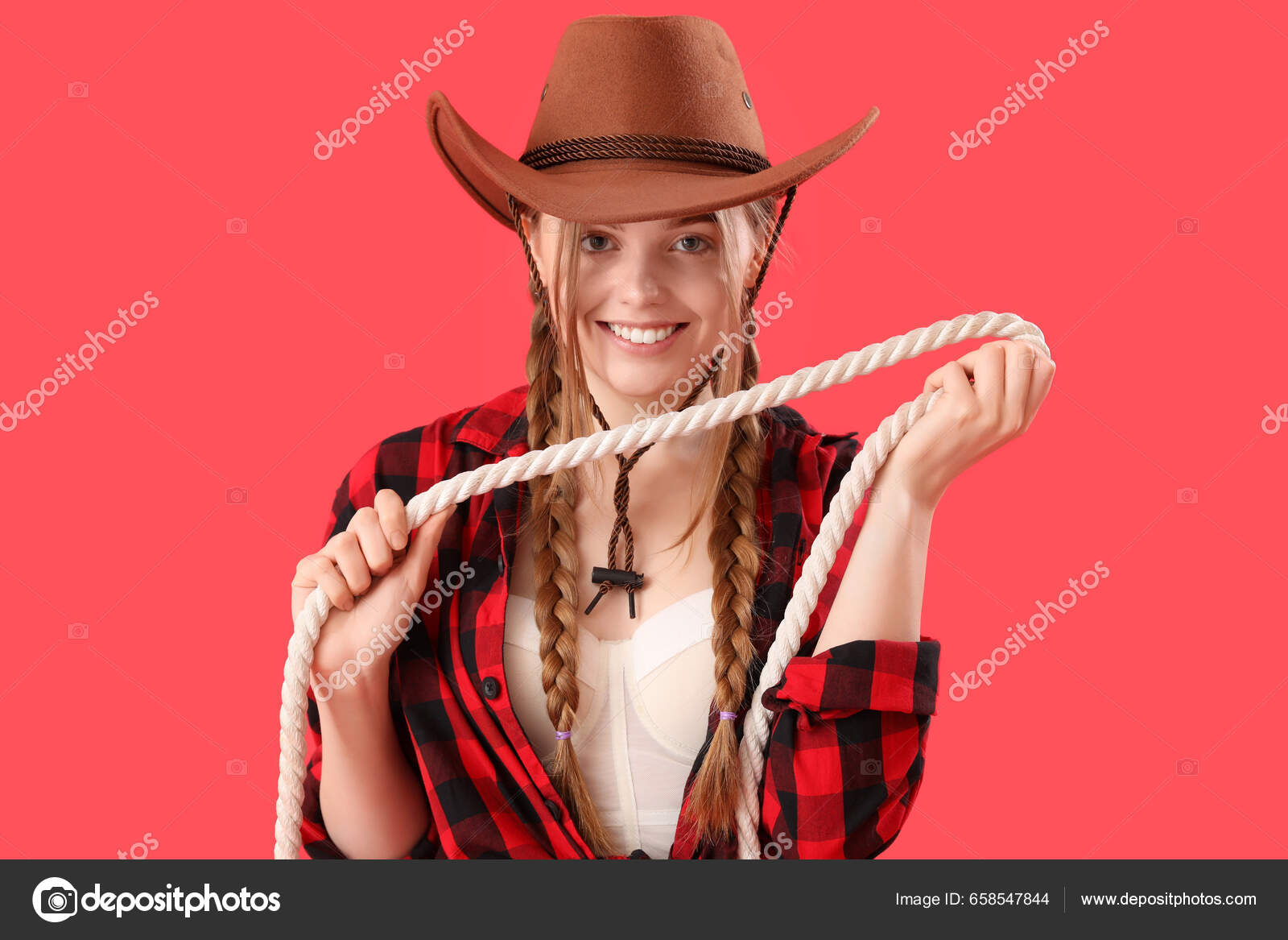 Young Cowgirl Lasso Red Background Closeup Stock Photo by ©serezniy  658547844