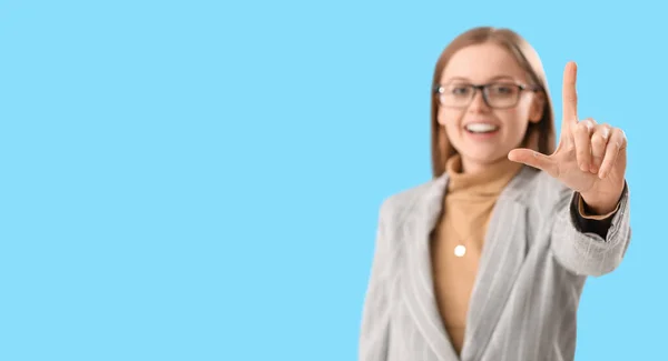 Laughing Young Businesswoman Showing Loser Gesture Light Blue Background Space — Stock Photo, Image