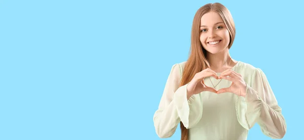 Happy Young Woman Making Heart Her Hands Light Blue Background — Stock Photo, Image