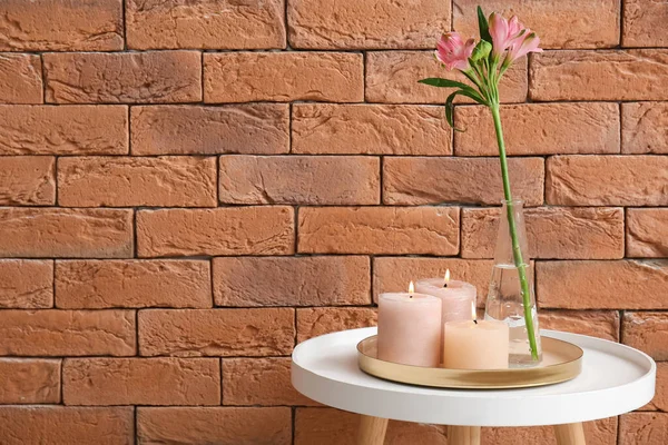 Burning Candles Vase Alstroemeria Flower Table Brown Brick Wall — Stock Photo, Image